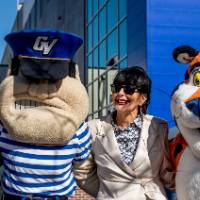 President Mantella standing with event guest, Louie the Laker, and Tony the Tiger